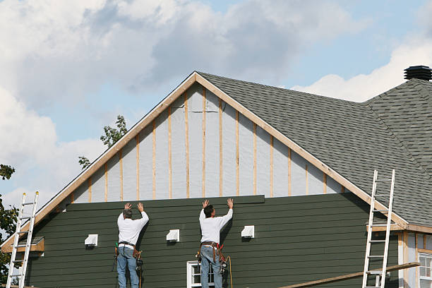 Professional Emergency Siding Repair technician working in Williamsburg, IN